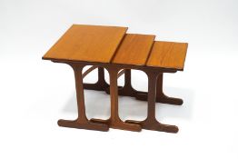 A nest of three Ercol style teak tables, the largest 51.
