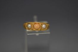 A late Victorian 18 carat gold three stone coral and split pearl ring, finger size N, 5.