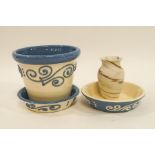 A Royal Barum Ware plant pot and stand, with raised swirl decoration, a further pot stand,
