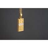 A 9ct gold diamond set ingot pendant on chain, the four small single cuts below the hallmark, 9.