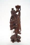 A Japanese root carving of a fisherman, converted to a lamp,