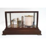 An oak cased Negretti & Zambra barograph, the case with chart drawer and charts,