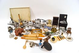 A collection of children's cooking utensils, including aluminium saucepans, kettles, rolling pins,