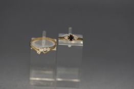 A 9 carat gold sapphire and illusion set diamond three stone ring;