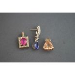 A single tanzanite and diamond 9 carat white gold drop earring; with two stone set pendants; 4.