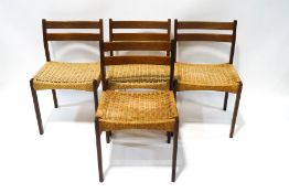 A set of four Danish teak dining chairs with papercord seats,
