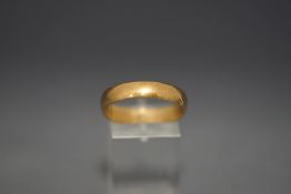 A 9 carat gold wedding ring, 3.