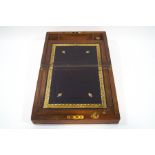 A Victorian walnut writing slope, with tooled gilt leather writing surface,