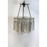 A cut glass hanging chandelier of lustre drops, 33cm high,