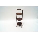 An Edwardian mahogany folding cake stand,