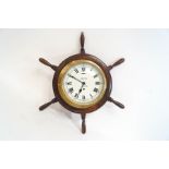 A Smiths Astral baulkhead clock, mounted onto a ships' wheel,