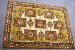 A large Middle Eastern machine woven carpet,