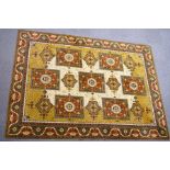 A large Middle Eastern machine woven carpet,