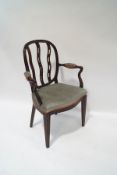 A French style mahogany elbow chair, with wavy pierced splat back and serpentine seat,