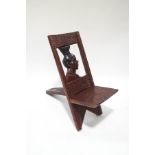 An African hardwood chair, the back carved with a woman's head,