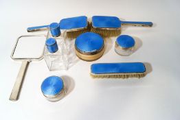 A matched blue guilloche enamel dressing table set, by Adie Brothers, Birmingham 1938 and 1939,