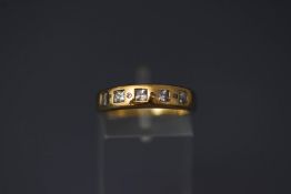 A 9 carat gold cubic zirconia set ring, finger size N1/2, 3.