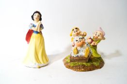 A Royal Doulton figure - 'Grumpy's Bathtime', and a Royal Doulton Snow White figure,
