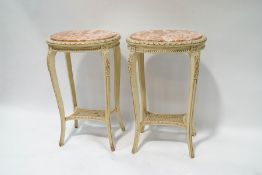 A pair of French painted tables with inset marble tops and cane undertier,