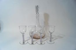 A set of four 'Twists' glasses and decanter,