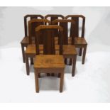 A set of six mahogany and walnut art deco style dining chairs with solid seats and square legs