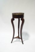 A French style mahogany jardiniere stand with pierced gallery above three slender shaped legs with