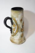 A Belgium stoneware flagon by Roger Guerin (1896-1954), decorated with a knight and shield,