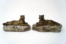 After Alphonse Alexandre Arson (1822-1880), a pair of bronze figures of lionesses upon quartz bases,