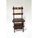 A late Victorian oak metamorphic chair/steps, with ecclesiastical detail,