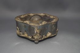 An electroplated jewellery casket, with embossed decorated borders, on ball supports,