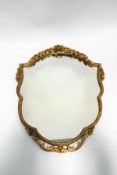 A 20th century gilt framed wall mirror, with floral and foliate moulding,