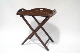 An early 20th century oak butler's tray and a folding stand,