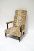 A Victorian mahogany armchair on turned supports,