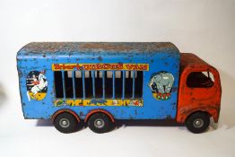 A Tri-ang Circus van, in blue and red livery,