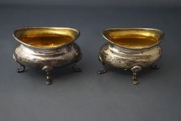 A pair of silver salts, by Mappin & Webb, Birmingham 1910, of oval outline, on four supports, 6.
