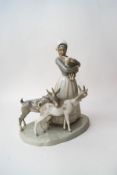 A Lladro figure of a lady attending her goats,