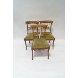A set of three Regency beech dining chairs, the top and centre rails with carved flower detail,