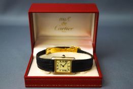 Must de Cartier, a lady's silver gilt tank wristwatch, on a strap with a deployment clasp,