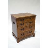 A 19th century mahogany chest of four drawers, with additional carrying handles to the sides,