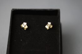 A pair of single stone diamond ear studs, the brilliant cuts totalling approximately 0.