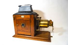 A Victorian Newton & Co mahogany and brass magic lantern,
