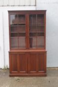 A late 19th/early 20th century mahogany glazed bookcase with adjustable shelves,