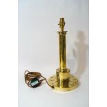 A 1920's brass table lamp, the base with punched flower decoration, 38cm high,