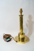 A 1920's brass table lamp, the base with punched flower decoration, 38cm high,