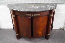 A Regency mahogany bow front sideboard with later additions and marble top,