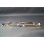 A pair of silver sugar tongs,