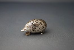 A modern silver hedgehog pin cushion, 4.