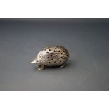 A modern silver hedgehog pin cushion, 4.