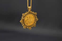 A 2005 half sovereign, in a 9 carat gold pendant mount, on a 9 carat gold chain, 13.