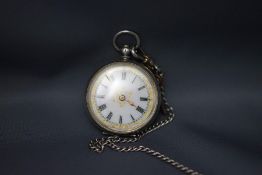A silver coloured fob watch, the case stamped '935',